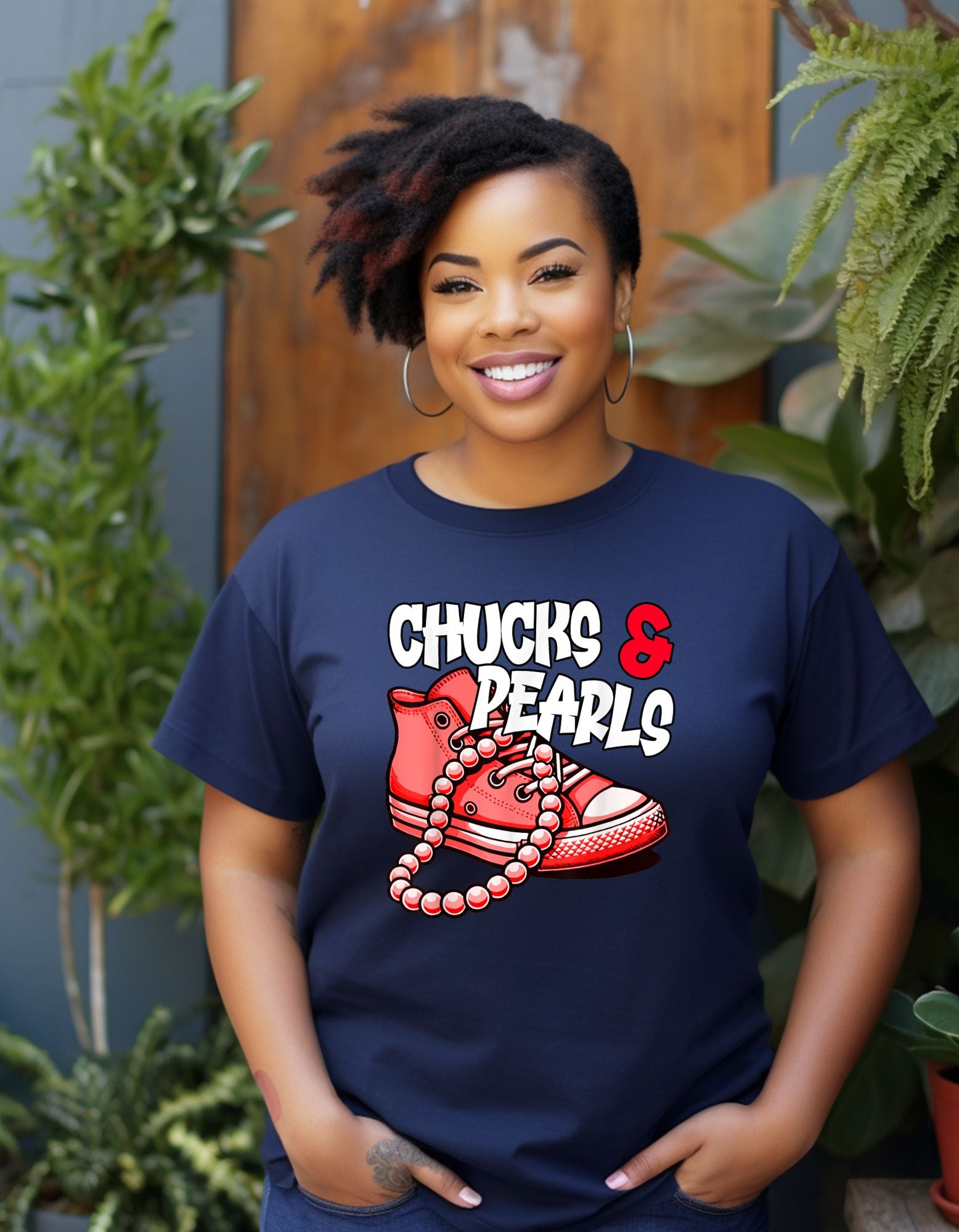 pink chunk shoe with string of pearls font reads chucks and pearls in white on navy blue shirt