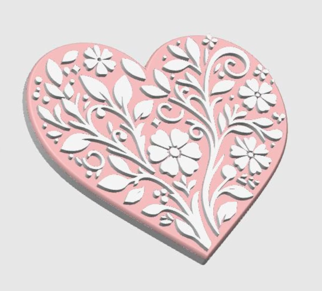 Decorative heart-shaped badge reel with floral patterns on a light gray background