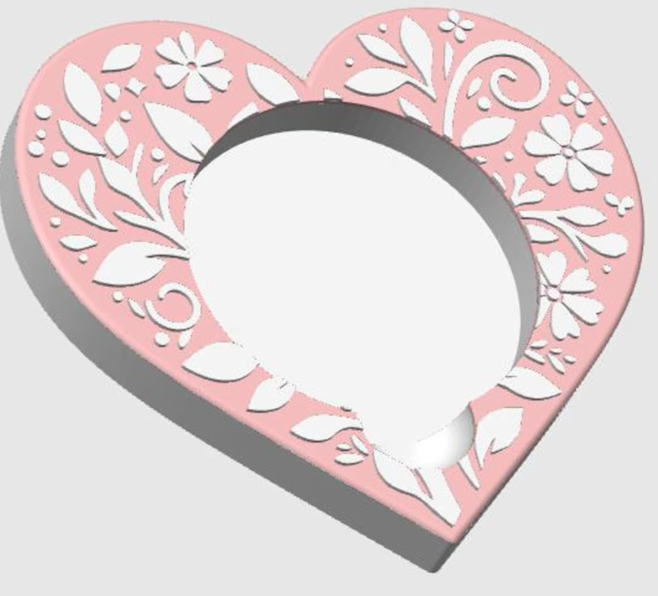 Heart-shaped round sticky note pad with floral designs on a light gray background