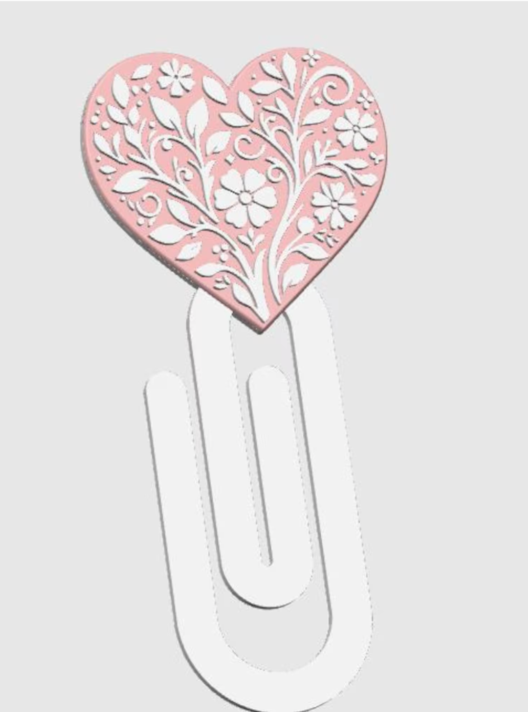Heart-shaped paperclip with floral design on a white background