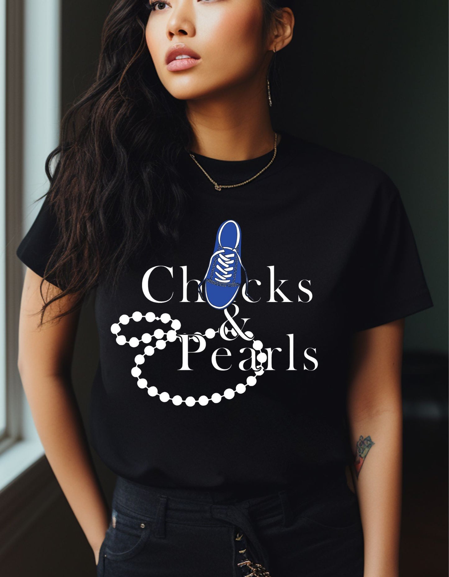 chucks and pearl, string of pearls and blue chuck featured on black shirt