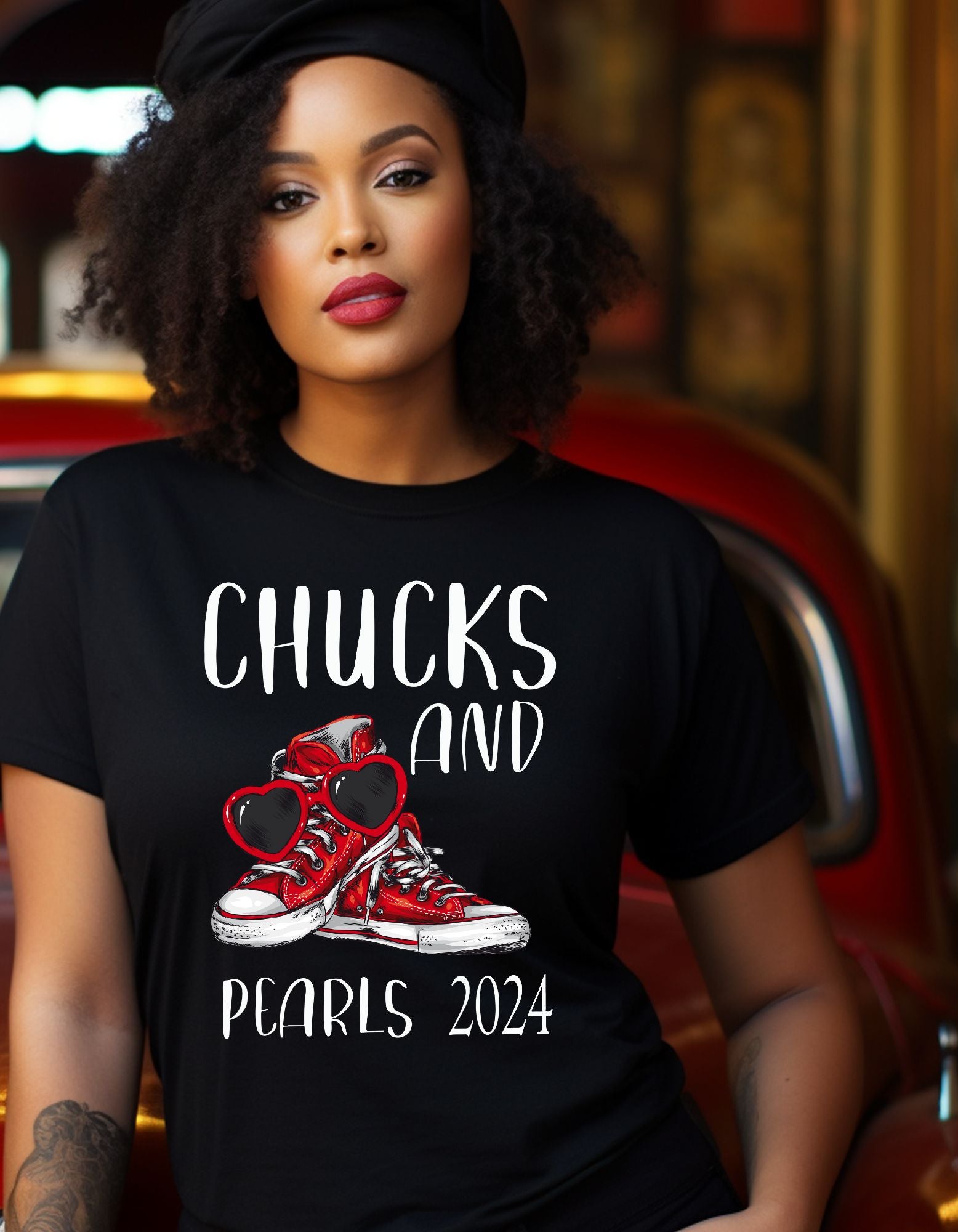 red chucks and pearls with read heart shape sunglasses, font print on shirt reads Chucks and Pearls 2024 white print on black shirt